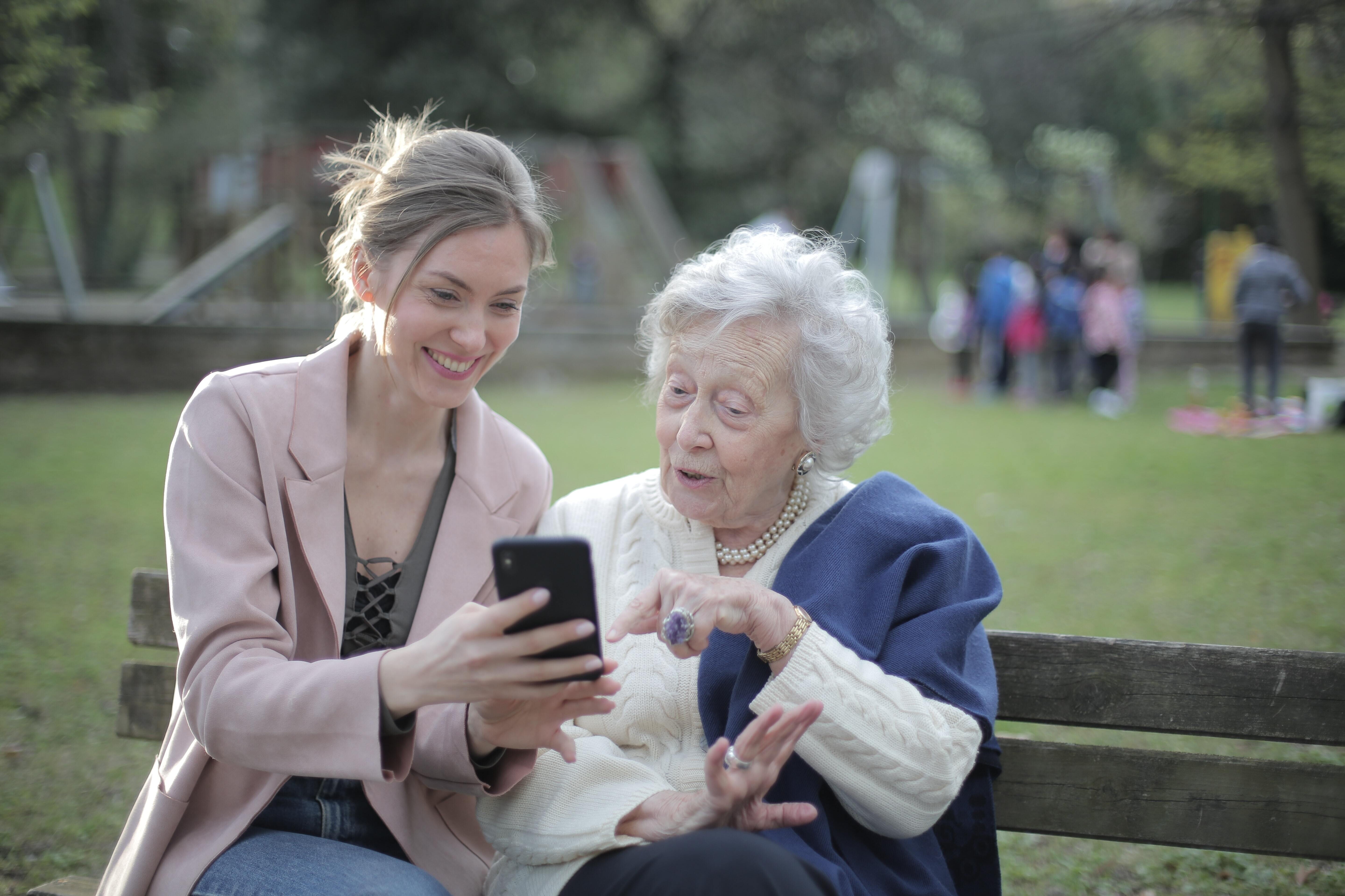 Two ladies sitting on a bench